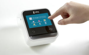 ZINK Wireless Touchscreen Printer. Wi-Fi Enabled. Built In App for Editing and Printing Photo & Labels On-The-Go. Prints Directly and from IOS & Android Smart Devices.