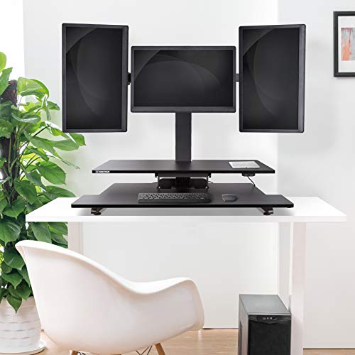 Stand Steady Techtonic | Electric 3 Arm Monitor Mount Standing Desk | Stand Up Desk Converter with Keyboard Tray Supports 3 Screens | Easy & Quiet Sit to Stand with the Push of a Button! (Black)