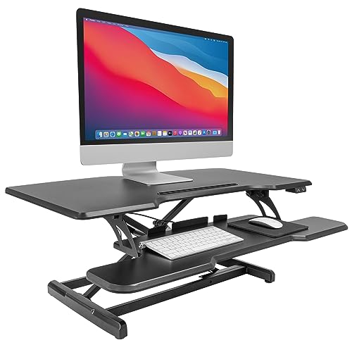 Mount-It! Electric Standing Desk Converter with 38" Tabletop, Height Adjustable Sit Stand Desk Riser, Motorized, Keyboard Tray, Device Slot - Black