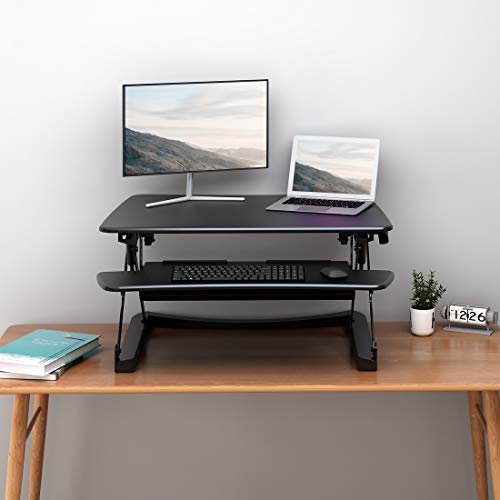 FlexiSpot M2B Standing Desk Converter - 35 Inch wide platform Height Adjustable Stand up Desk Riser with Removable Keyboard Tray (Medium size Black)