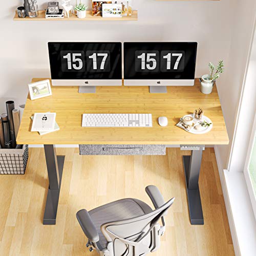 FEZIBO Electric Height Adjustable Standing Desk with Drawer, 48 x 24 Inches Splice Board, Black Frame/Bamboo Top